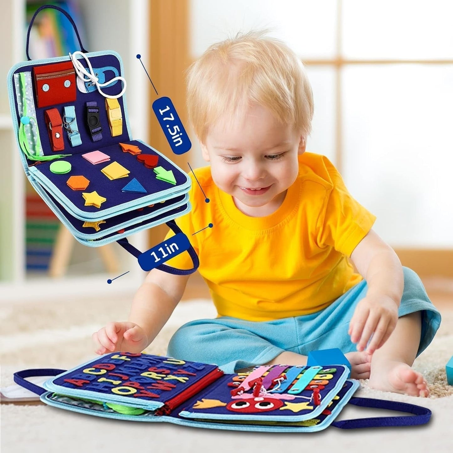 Two young children playing with blue Montessori busy board upgraded edition on floor, foldable 11-in-1 felt activity board with zippers buttons buckles and shape sorting panels, educational toy for toddlers and preschoolers.