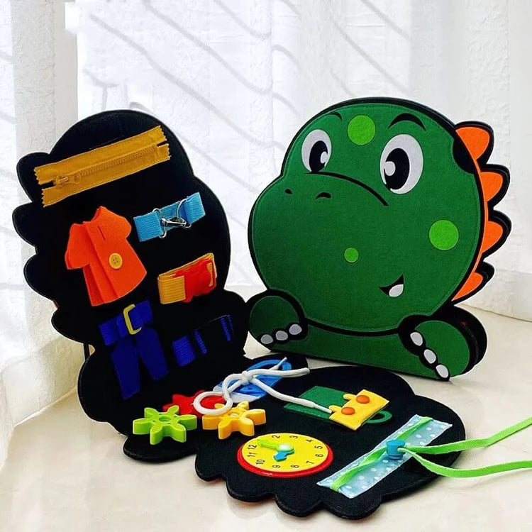 Montessori Dino Busy Board with colorful educational activities, including zippers, buckles, and laces for developing fine motor skills, problem-solving, and early learning.
